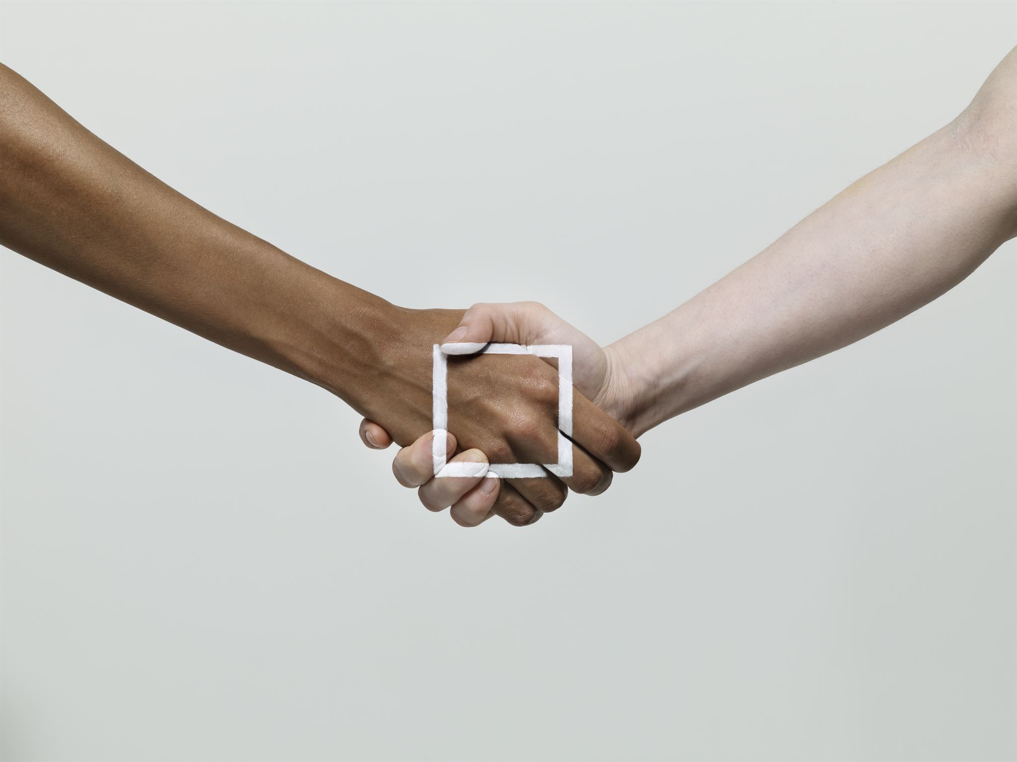 hands shaking partnership agreement